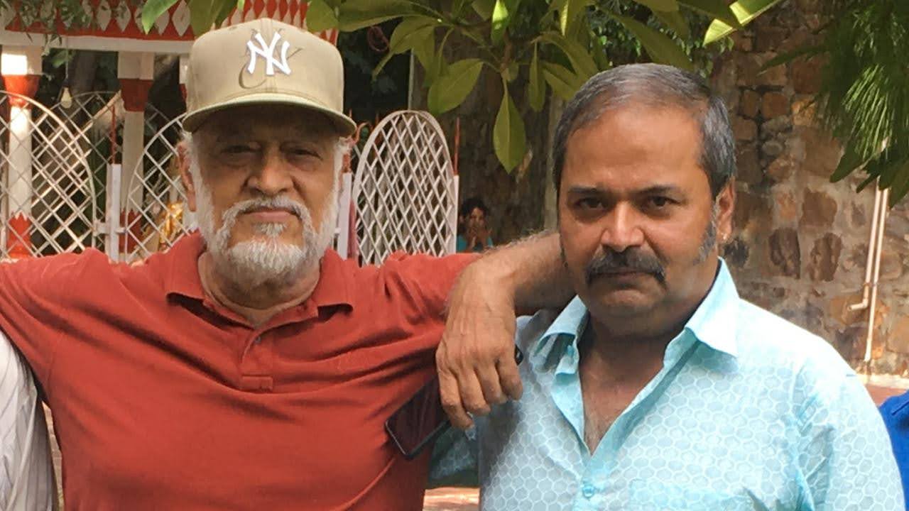 Close portrait of बिटटू बेकार with a colleague at a garden gathering